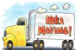 A yellow moving truck with a sign that says 'We're Moving!' on its side.