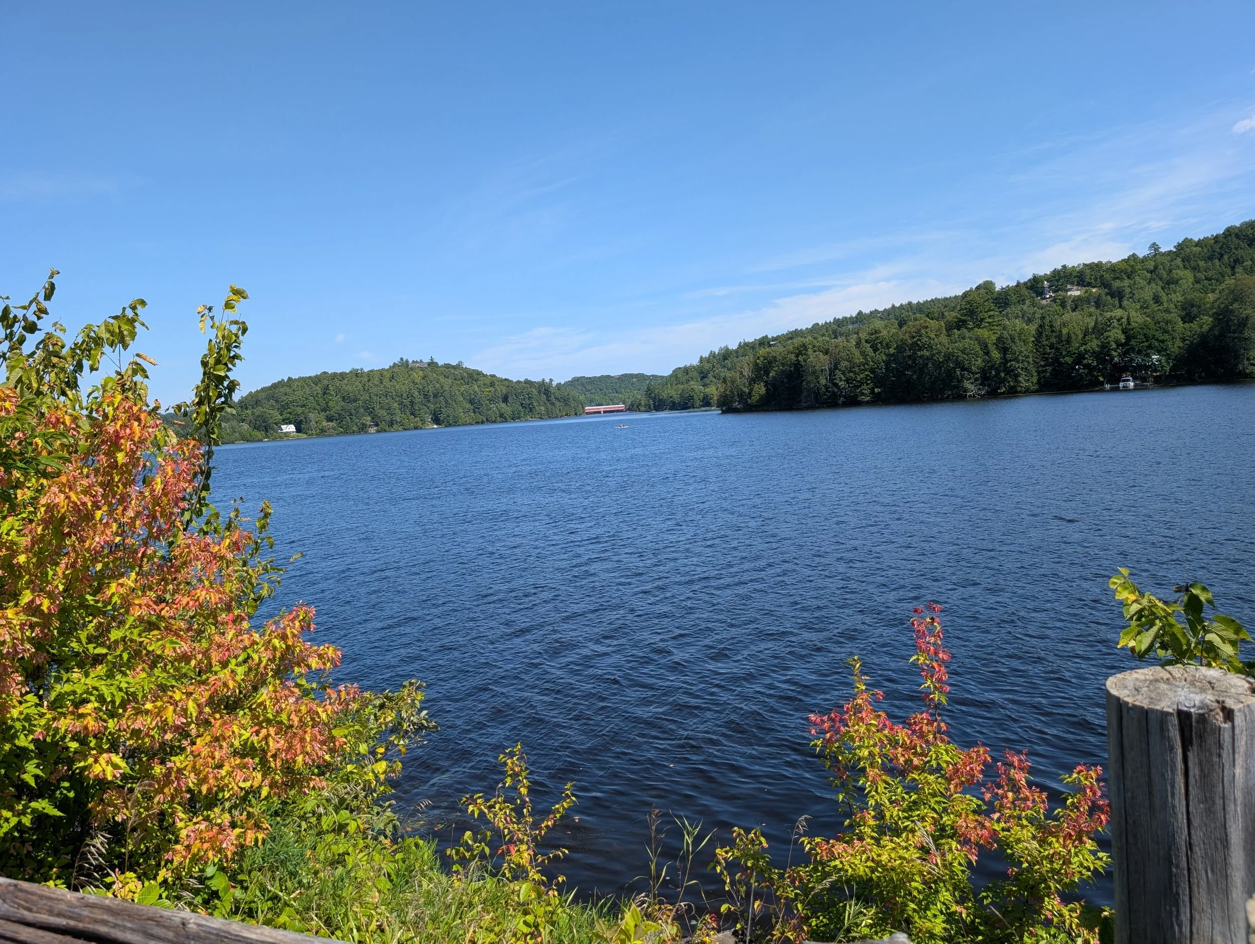 Gatineau River in Wakefield, Quebec, with early fall foliage along the shoreline