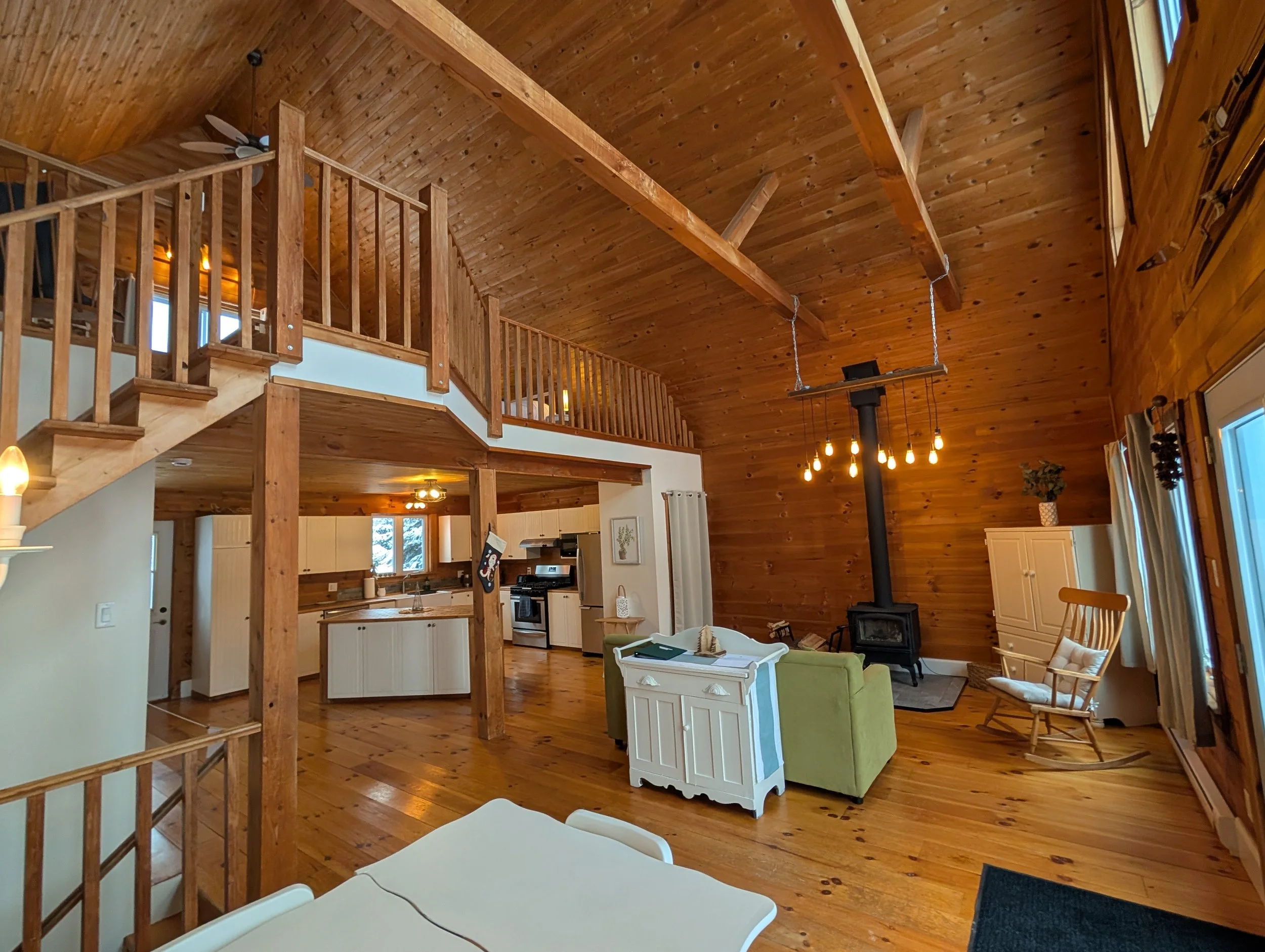 Main living area with view of the kitchen and Cedar loft