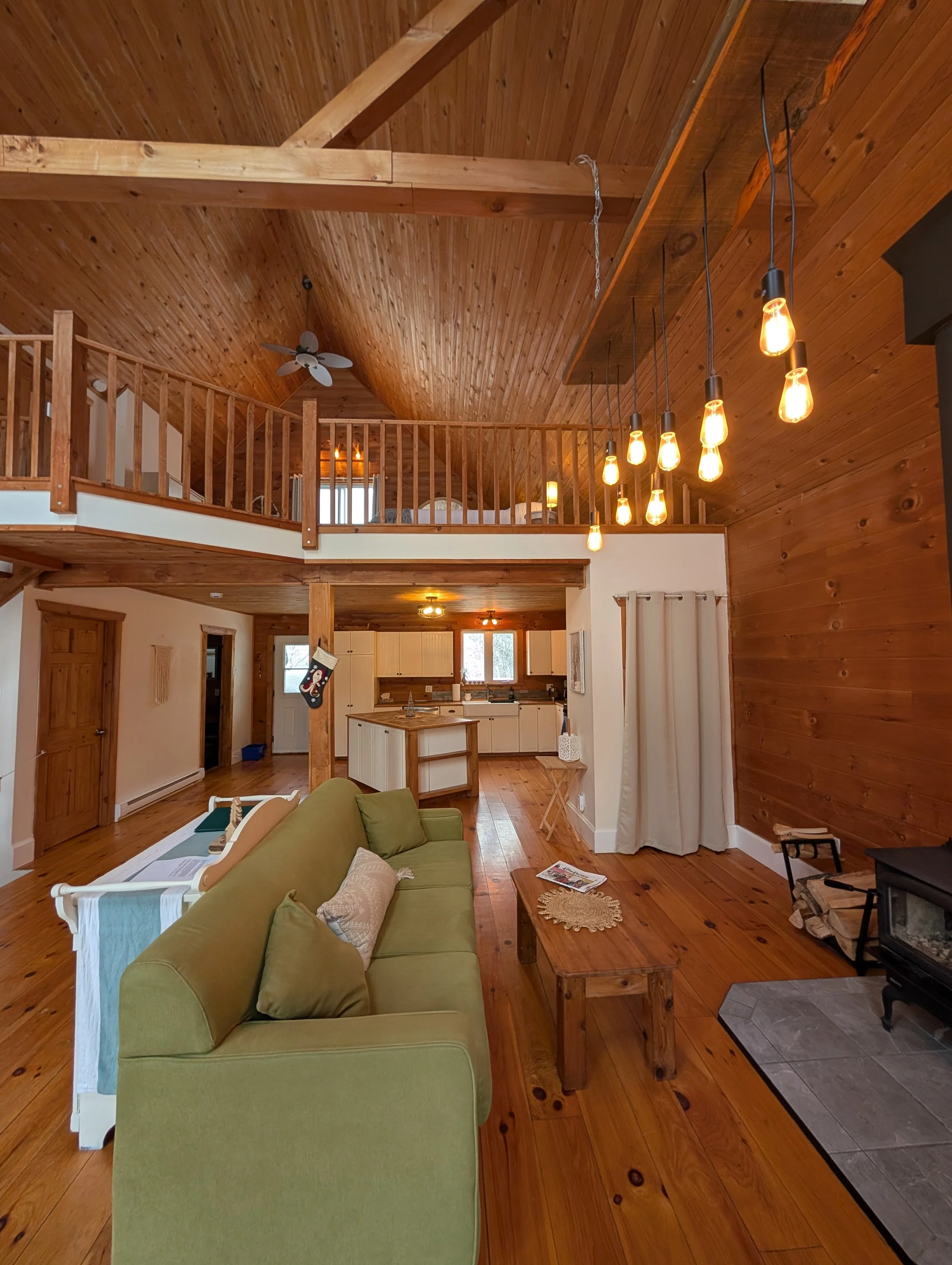 Main living area with view of the kitchen and Cedar loft