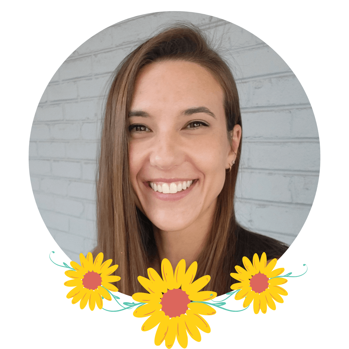 A woman with long brown hair smiling in front of a brick wall, decorated with a floral border of yellow flowers.