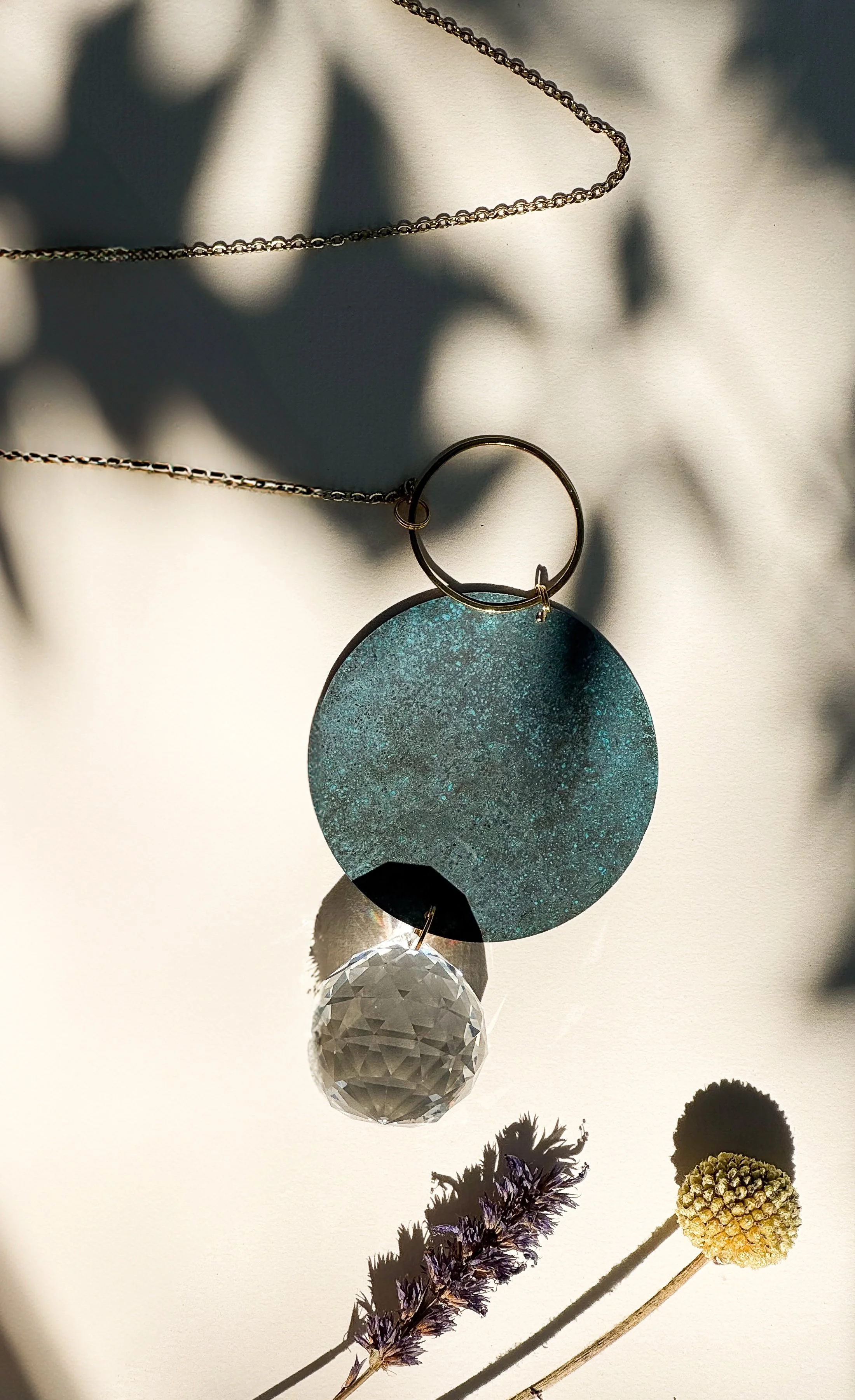 NUA – Handmade Brass Suncatcher with Deep Blue Patina & Crystal
