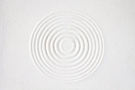 Close-up of a white textured surface with concentric circular ridges.