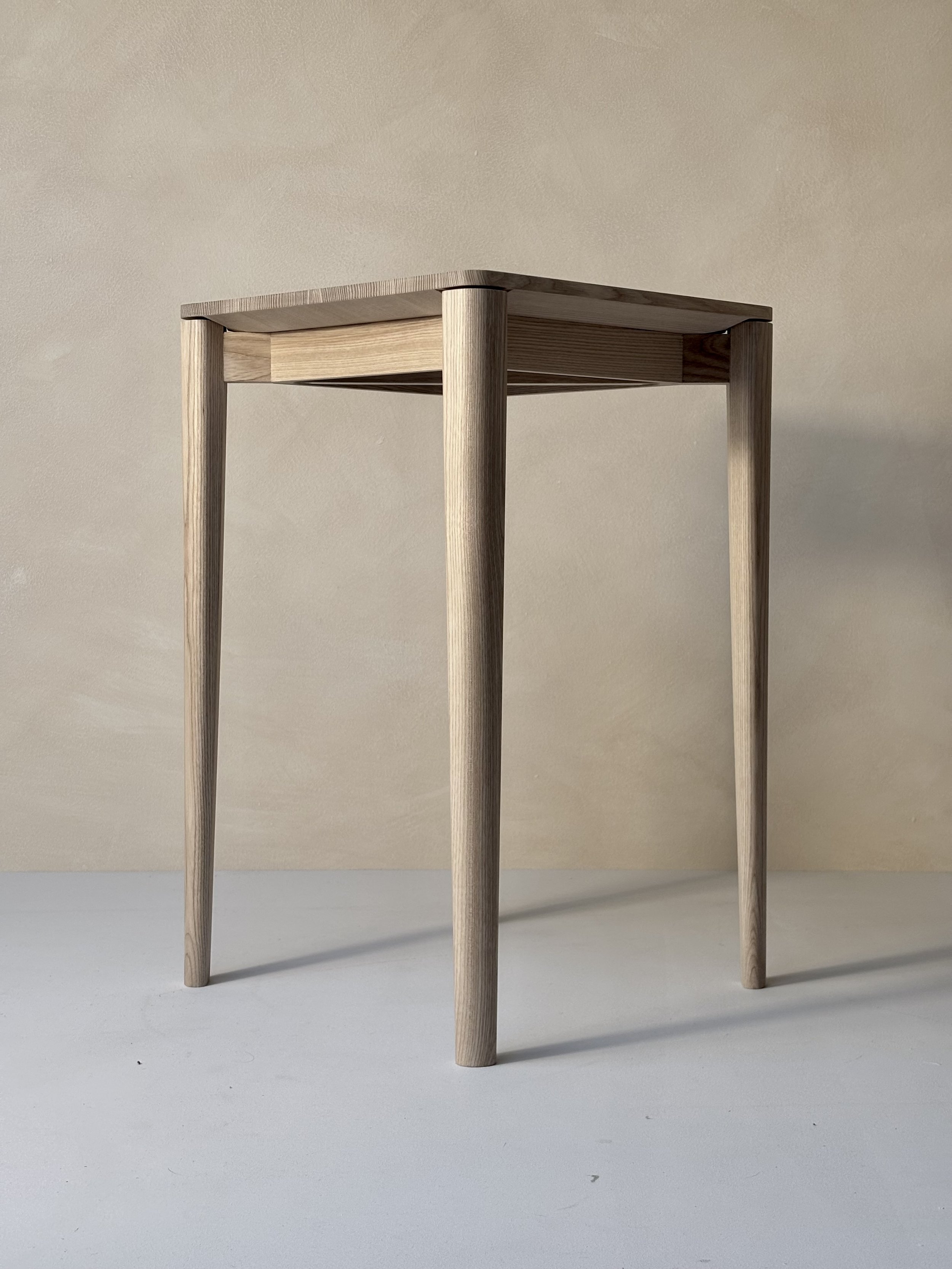 June Table by Mitch Polley Design, close up of top and leg detail. A minimalist side table with clean lines, handmade from English Ash.