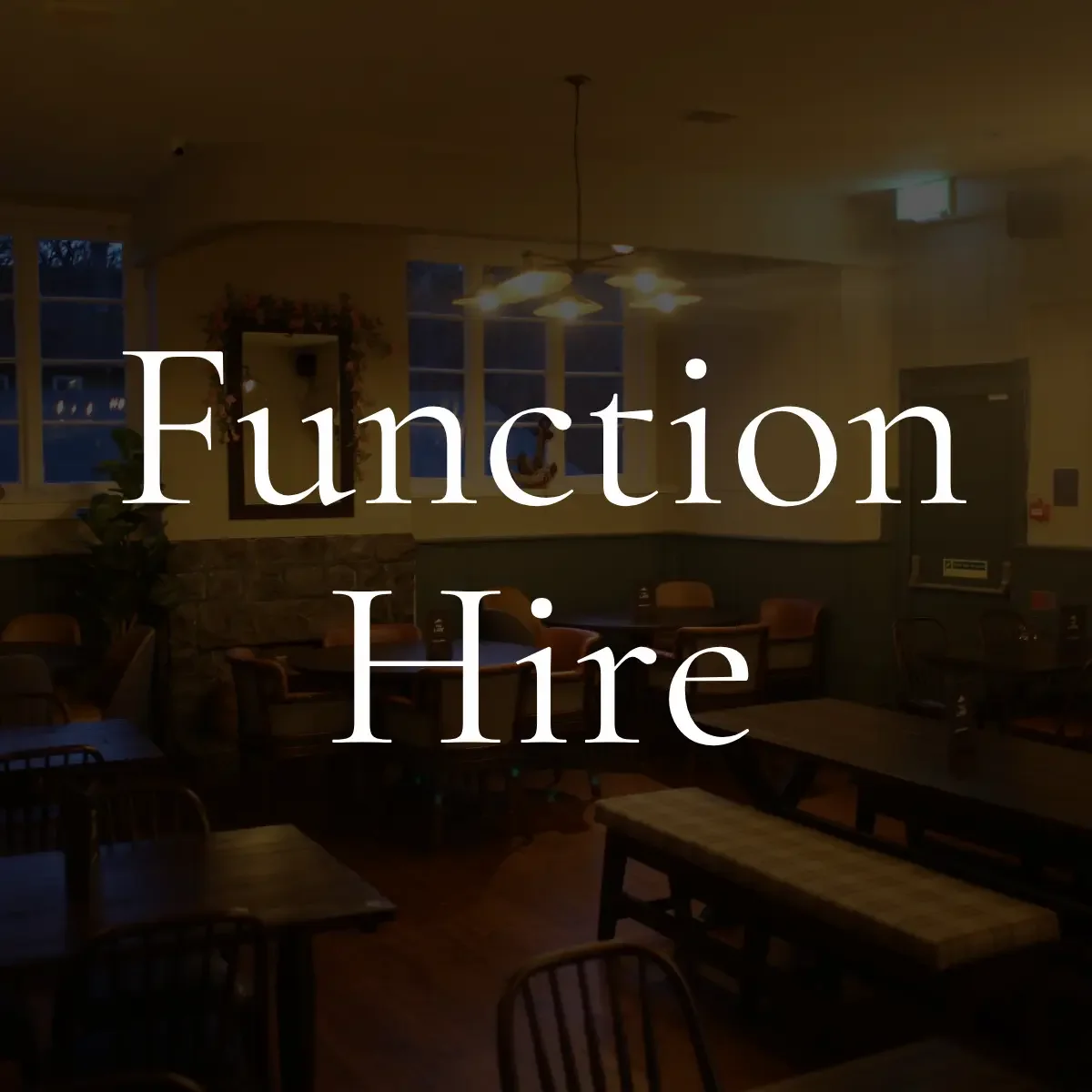 An indoor restaurant or cafe with closed chairs and tables, dim lighting, and large windows, overlaid with the text 'Function Hire' in large white letters.