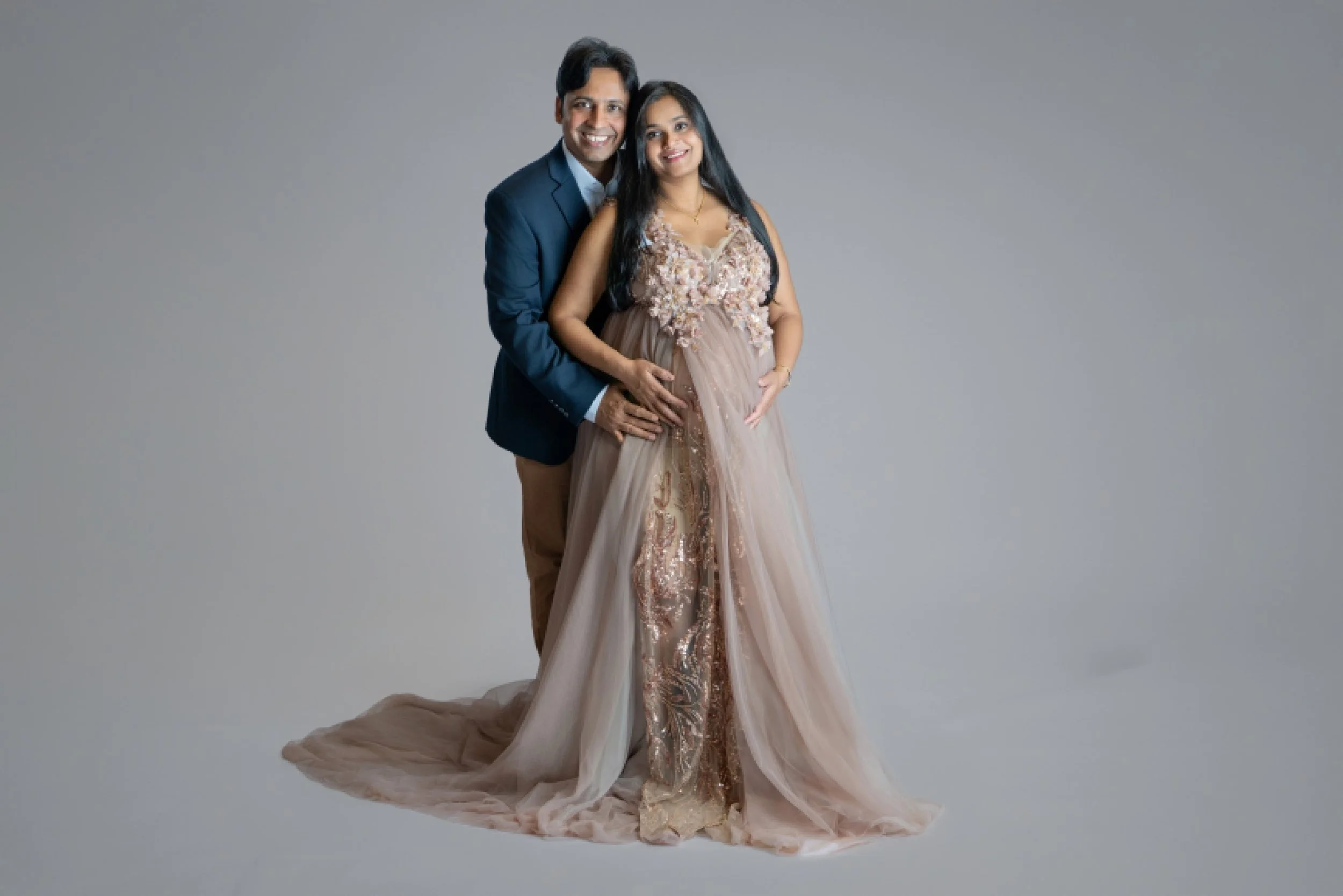 Studio maternity portrait of an expecting couple in West Windsor, New Jersey