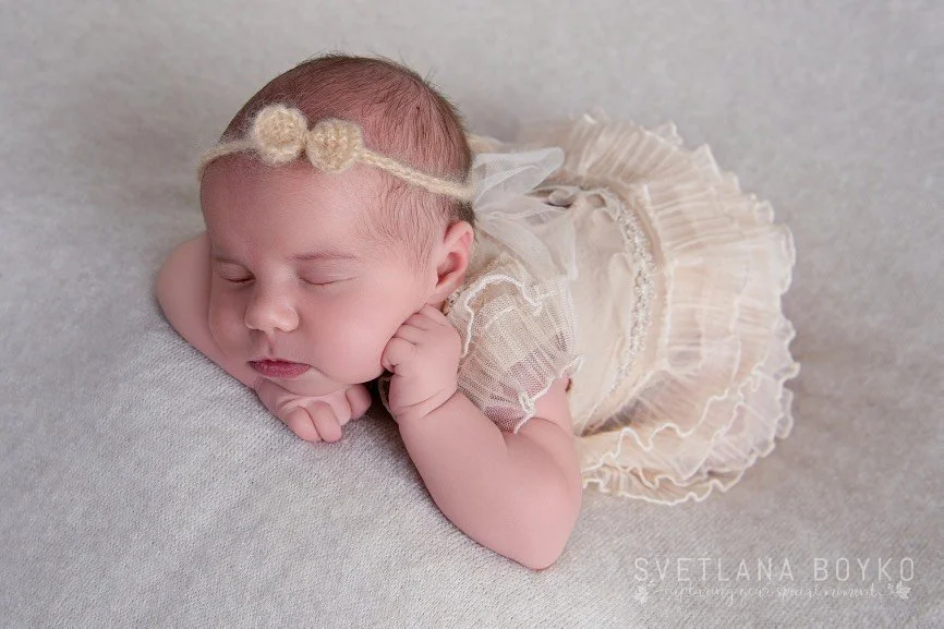 Newborn baby girl wrapped in pink blanket West Windsor NJ newborn photographer.