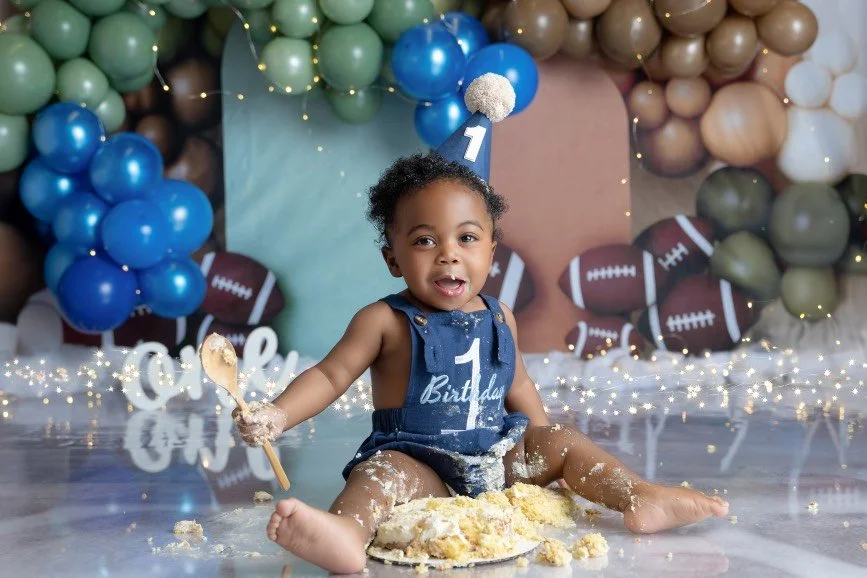 First birthday cake smash photography featuring a baby celebrating one year in a styled studio setup in New Jersey