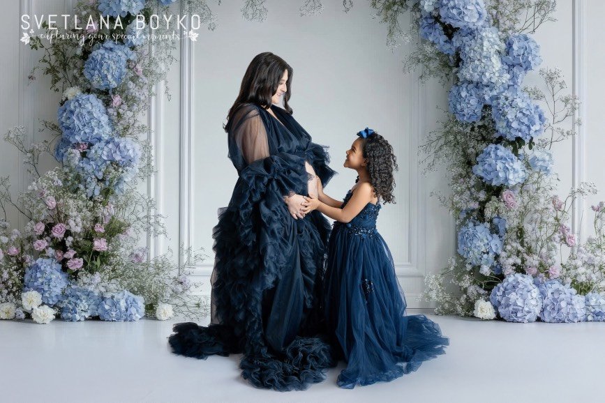 Studio maternity photography session captured in South Brunswick, New Jersey, with an expecting mother and her daughter