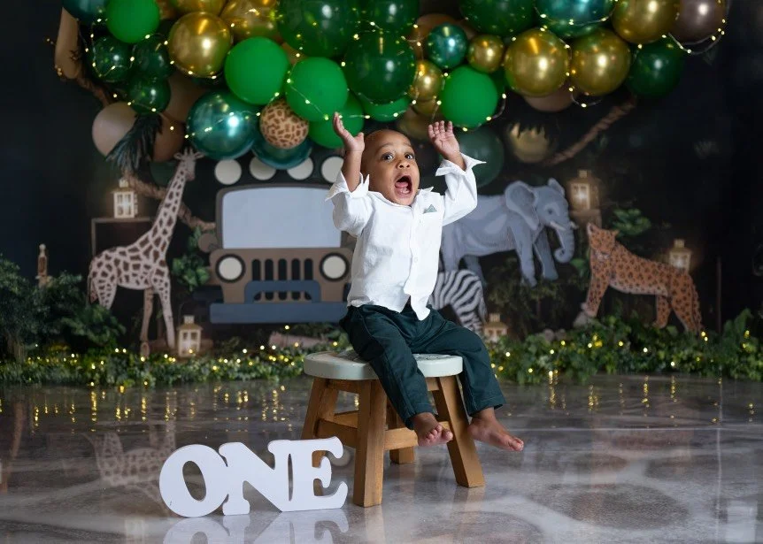 Baby boy first birthday cake smash with blue cake in Bucks County PA photography studio