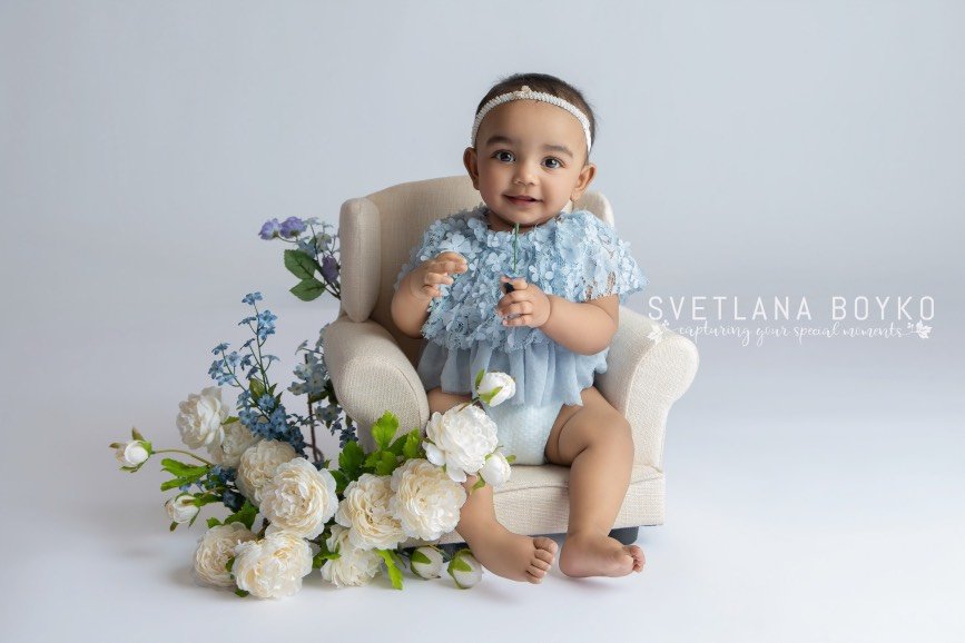 Six-month-old sitter baby girl photographed during a milestone session in a Central NJ studio