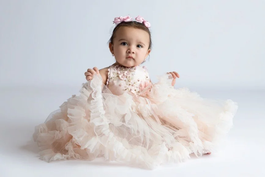 Sitter baby photographed during a milestone session in a professional studio in West Windsor, NJ