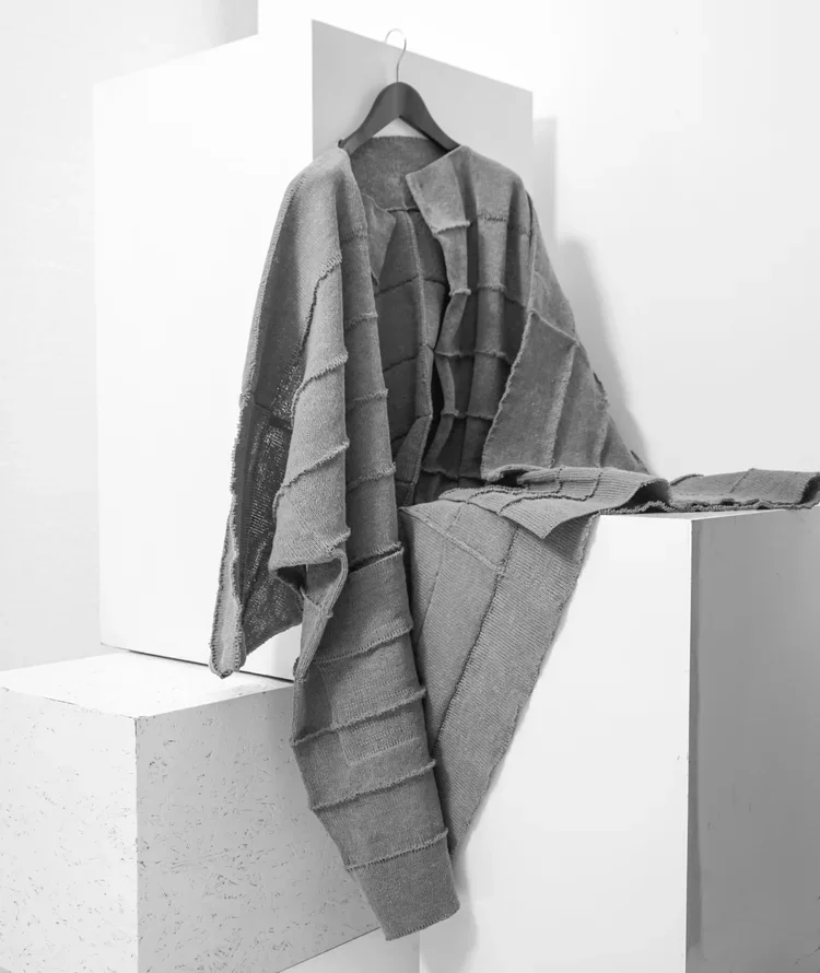 Issey Miyake Disconnected Linen Knit | Fashion Research Archive London
Grey Issey Miyake linen knit featuring exposed panel construction and sculptural layered texture.
An Issey Miyake knitted piece exploring deconstructed construction through layere