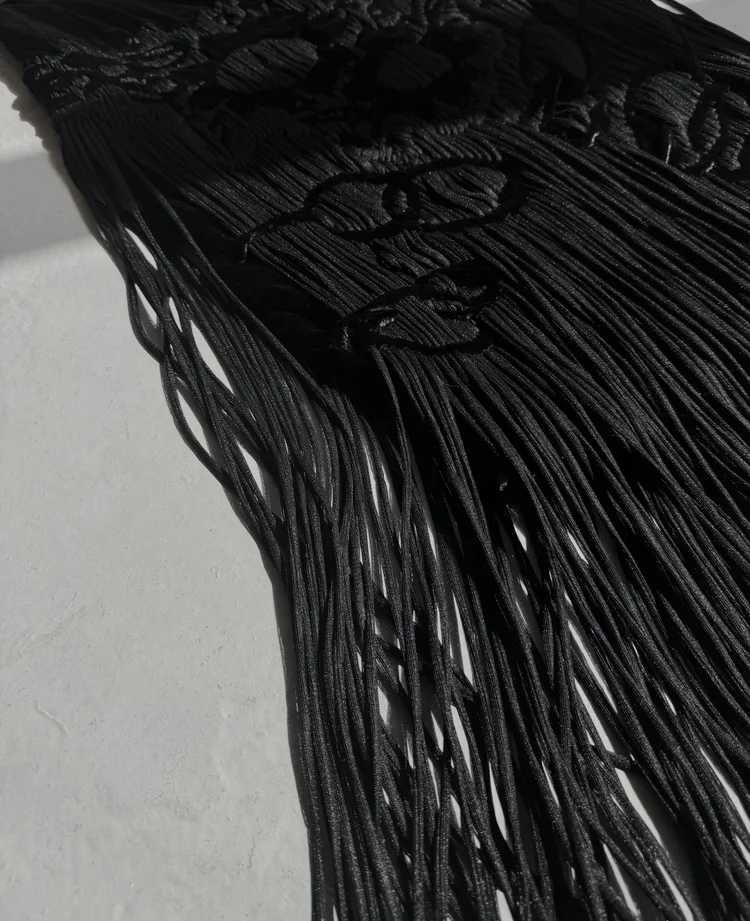 
Tom Ford for Yves Saint Laurent Ribbon Skirt | 18.01LONDON Archive
Alt Text
Black Tom Ford for Yves Saint Laurent skirt featuring dramatic cascading ribbon fringe.
Meta Description
A Tom Ford-era Yves Saint Laurent runway design showcasing fluid rib