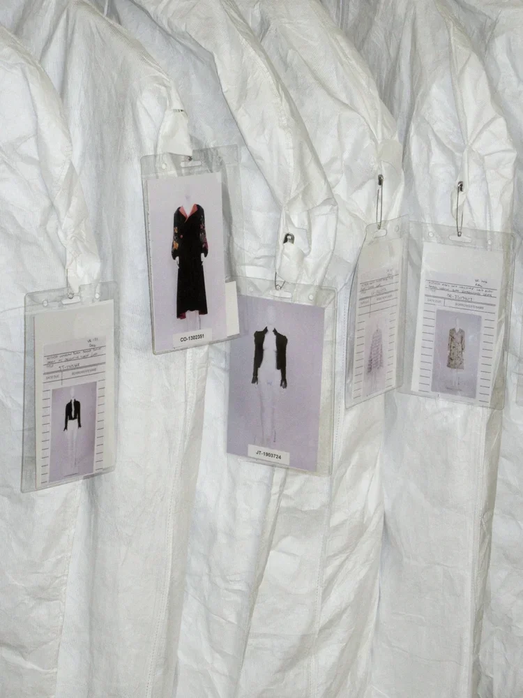 Fashion Archive Storage Process | 18.01LONDON Collection Management

Garments stored in protective Tyvek covers with archive identification cards attached.

Behind the scenes at 18.01LONDON showing museum-standard garment storage, cataloguing systems