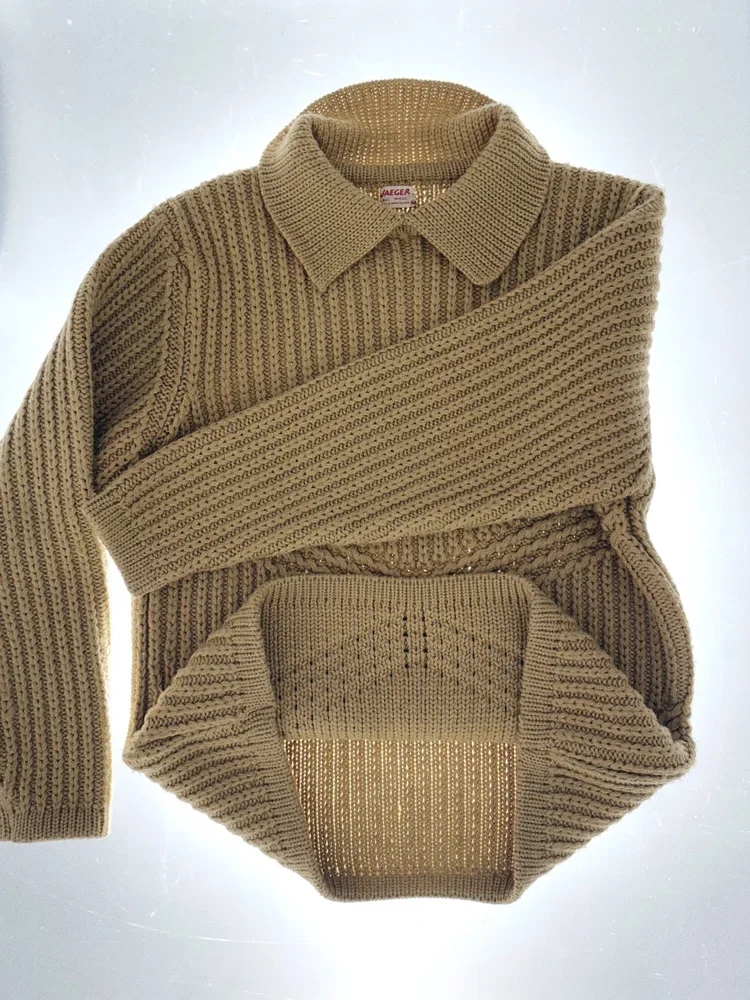 
Jaeger Ribbed Knit Polo | 18.01LONDON Fashion Archive
Vintage Jaeger ribbed knit polo sweater with structured collar from the 18.01LONDON fashion archive, available for luxury fashion research appointments in London.
Exceptional British knitwear sho