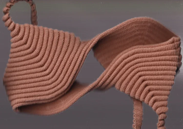 Sculptural Rib Knit Bra Construction | Fashion Research Archive London
Architectural rib knitted bra featuring engineered curved panels and seamless sculptural shaping.
A study in engineered knitwear construction, demonstrating how continuous rib str