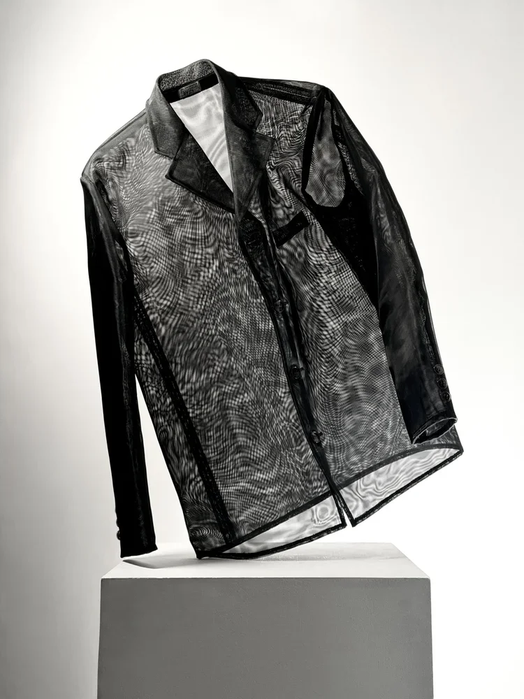 Sheer Mesh Moiré Jacket | 18.01LONDON Fashion Archive

Black sheer mesh jacket featuring moiré optical texture and transparent tailoring.

A contemporary mesh jacket showcasing transparency, moiré effects and lightweight tailoring for fashion researc
