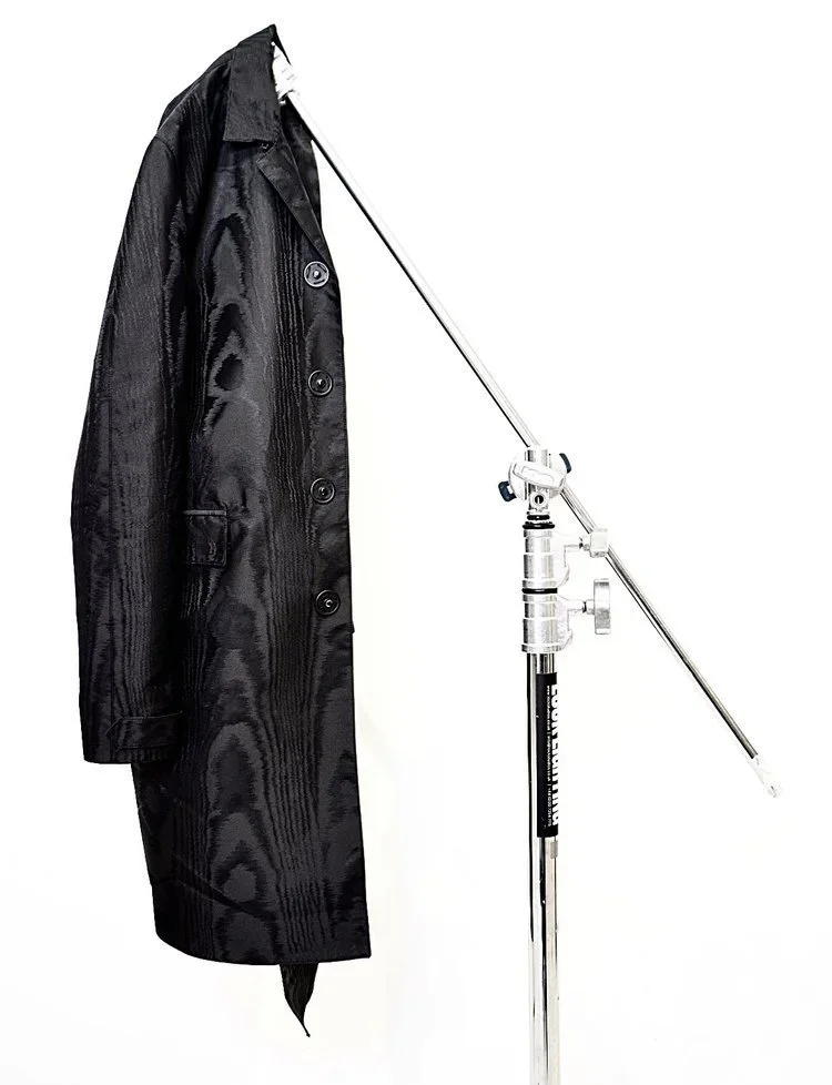 Burberry Prorsum Menswear Moire Single breasted coat, shot at the 18.01LONDON Archive in London. Minimal Technical Outerwear
Technical black outerwear featuring clean panel construction, subtle surface texture and restrained detailing, emphasising pr