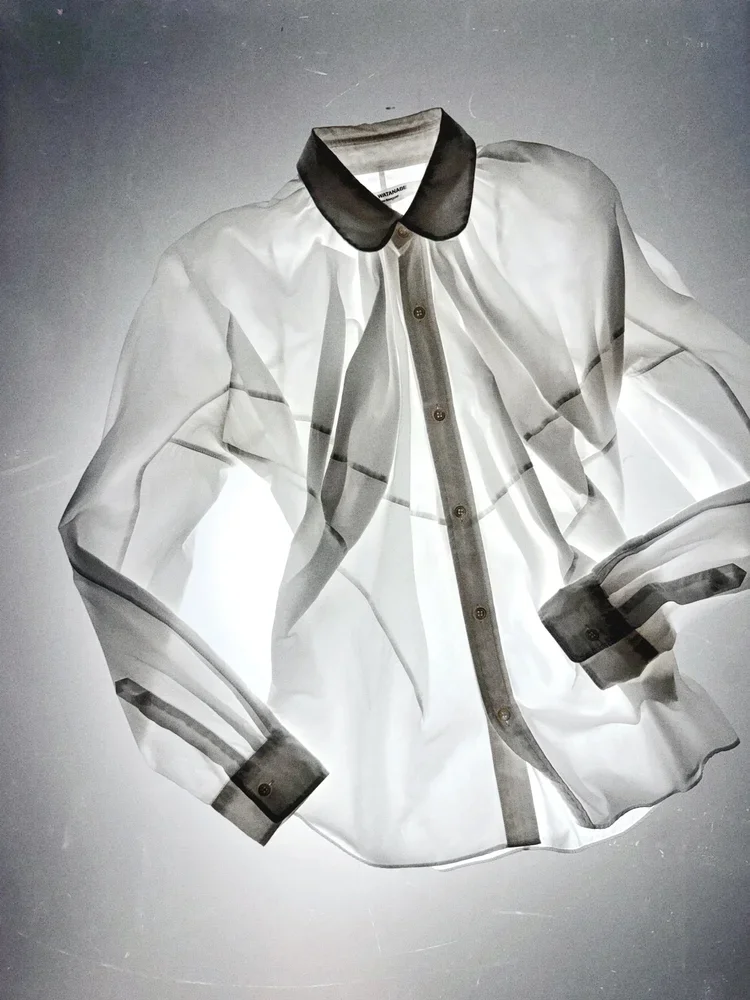 
Junya Watanabe Sheer Shirt | 18.01LONDON

Junya Watanabe cotton shirt with transparent panel construction preserved in the 18.01LONDON archive.

Architectural pattern cutting and layered transparency.
