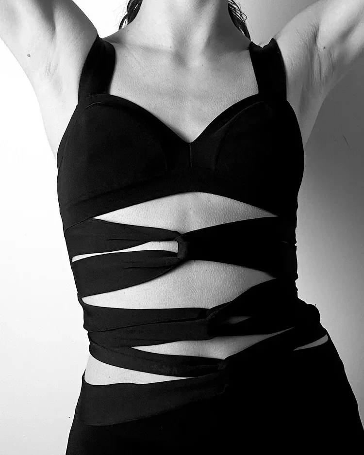 Roberto Cavalli Cut-Out Knit Dress | 18.01LONDON Fashion Archive

Black Roberto Cavalli knit dress featuring sculptural cut-outs and wrapped construction.

Roberto Cavalli knit dress exploring body-contouring construction, cut-out detailing and conte