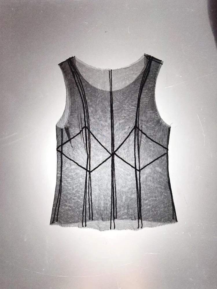 
Sheer Mesh Top | 18.01LONDON
Transparent mesh sleeveless top featuring graphic seam construction from the 18.01LONDON archive.

Minimal construction with maximum visual impact.
