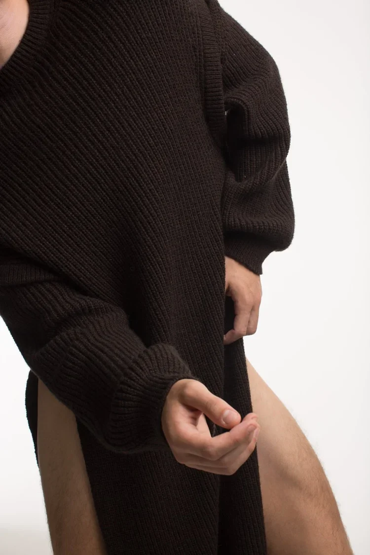 
Transformable Chocolate Brown Knitwear | 18.01LONDON Archive

Oversized chocolate brown ribbed knit garment featuring transformable openings and sculptural silhouette.

Experimental knitwear demonstrating transformable construction, engineered openi