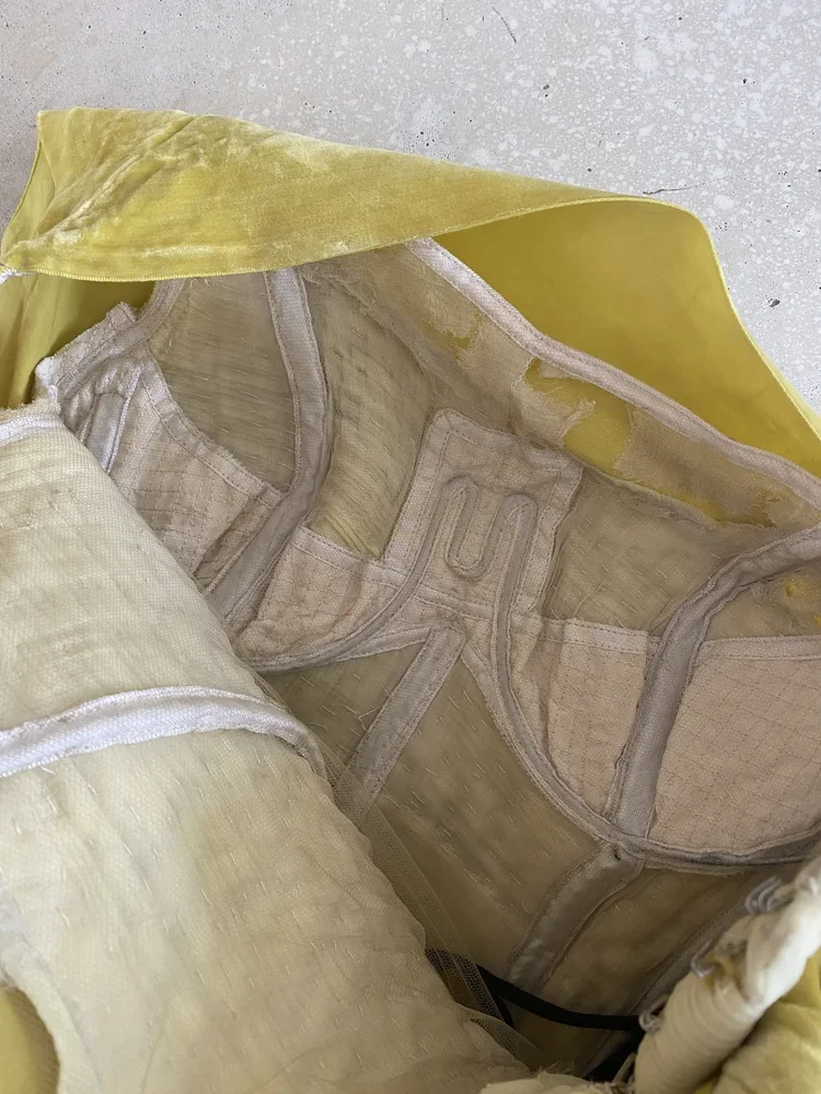 Vintage Couture Attributed to Madame Grès Interior Construction | Fashion Research Archive London
Interior construction of vintage couture gown attributed to Madame Grès showing corsetry, hand finishing and structural foundation.
An interior view of 