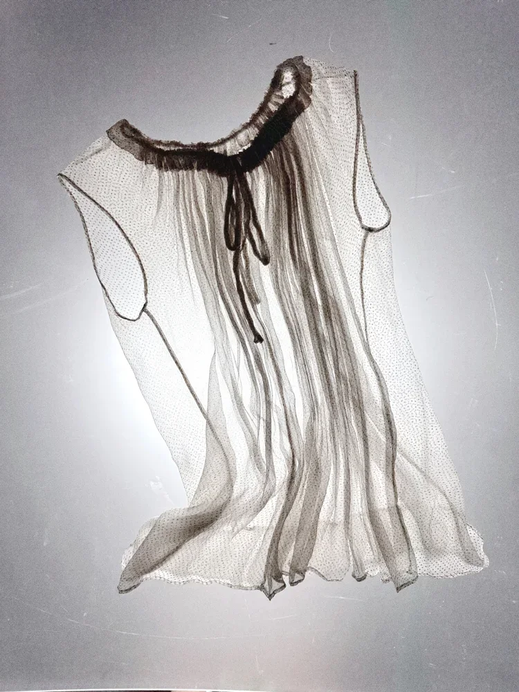 
Yves Saint Laurent Sheer Blouse | 18.01LONDON Fashion Research Archive

Vintage Yves Saint Laurent sheer polka dot blouse from the 18.01LONDON fashion archive available for fashion research.

Elegant transparency and timeless couture detailing.
