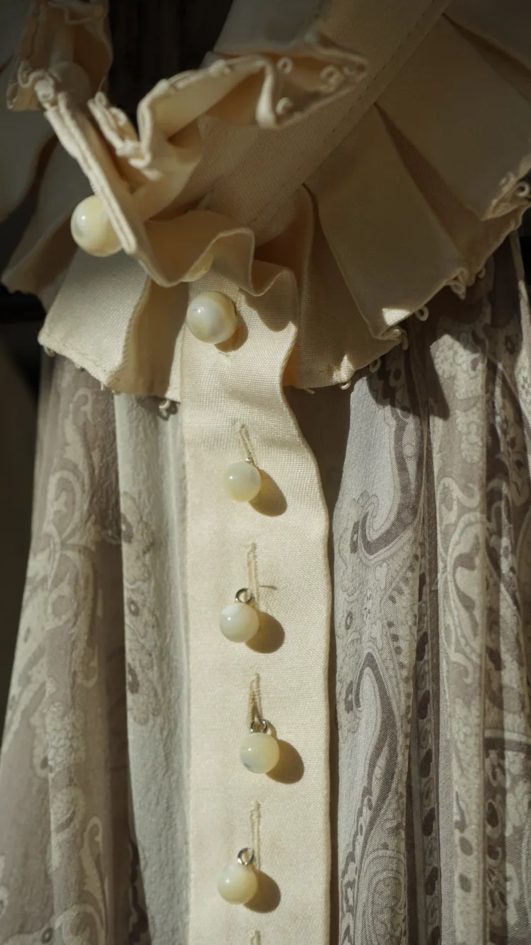 Nicolas Ghesquière for Balenciaga Silk Ruffle Blouse | 18.01LONDON Archive

Close-up of a Nicolas Ghesquière Balenciaga silk blouse featuring sculptural ruffles, pearl buttons and sheer paisley silk.

A rare Nicolas Ghesquière-era Balenciaga silk blo