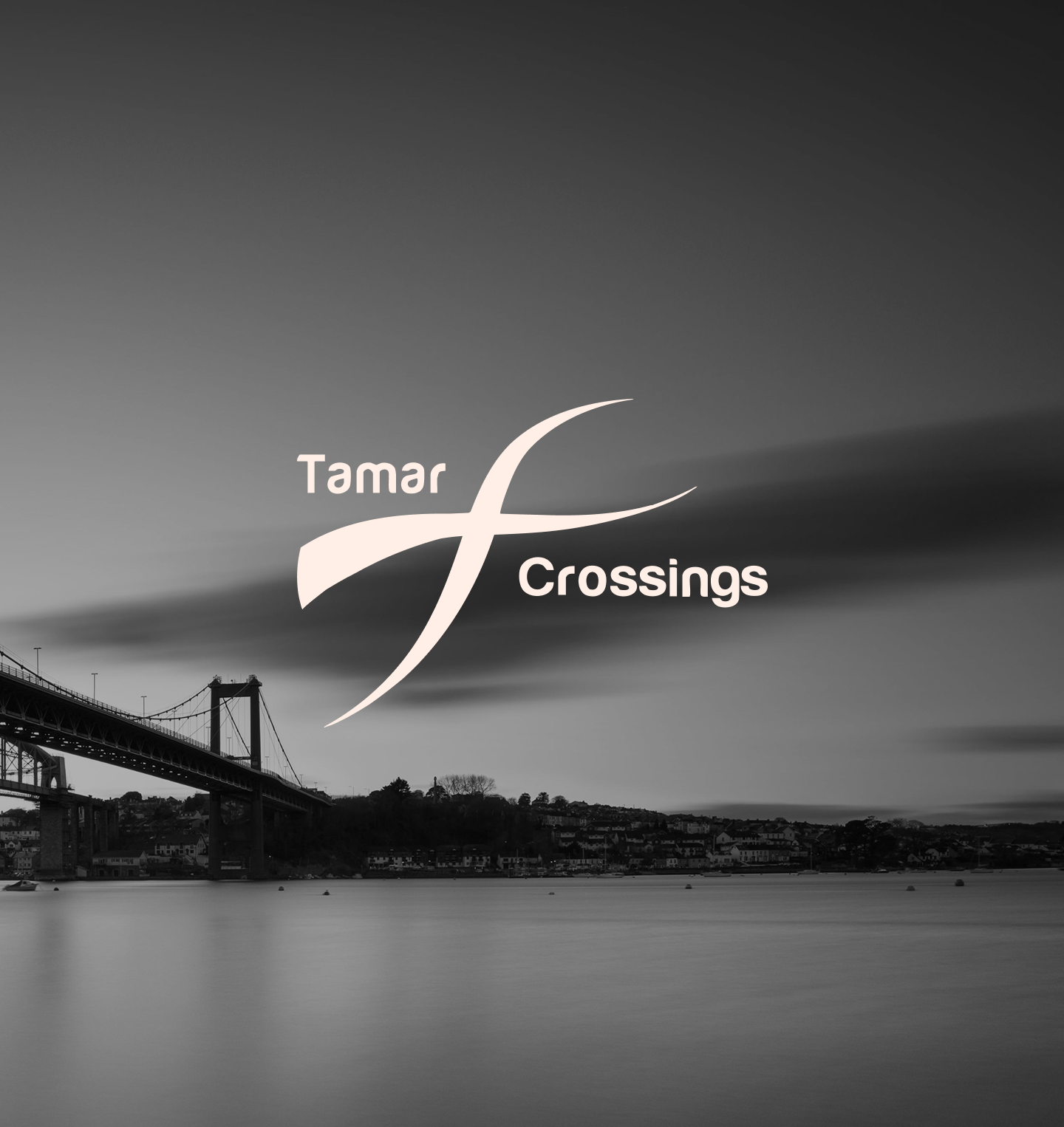 Black-and-white photo of a bridge over a body of water with a cityscape on the shoreline. The image has the words 'Tamar Crossings' displayed in the center with Tamar Crossings logo overlayed.