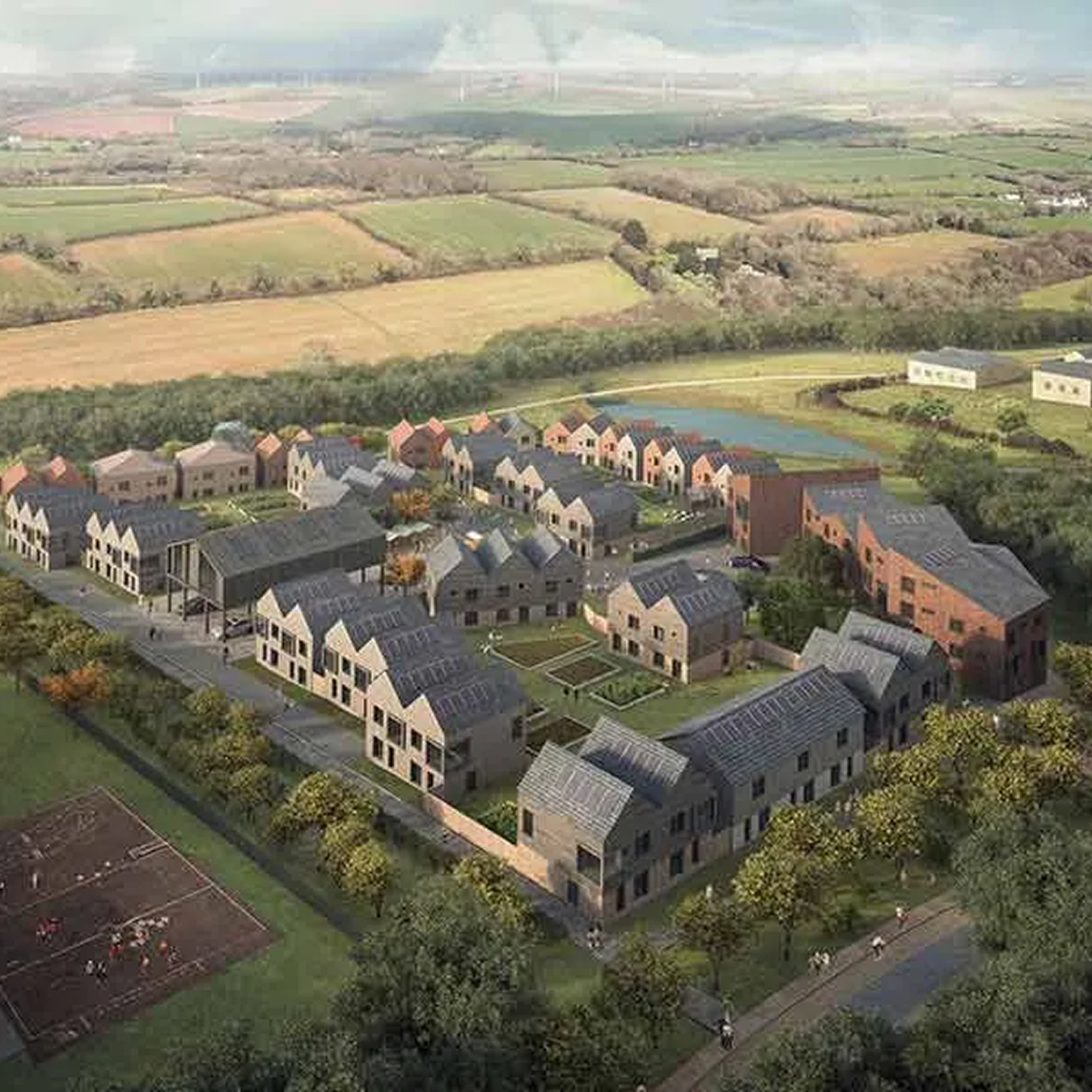 Aerial view of a modern residential housing development with multiple buildings, green spaces, a pond, and surrounding farmland.
