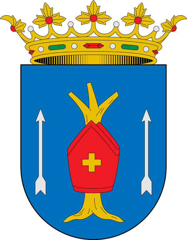 Escudo con un árbol y una cruz en rojo, sobre fondo azul, con una corona dorada en la parte superior.