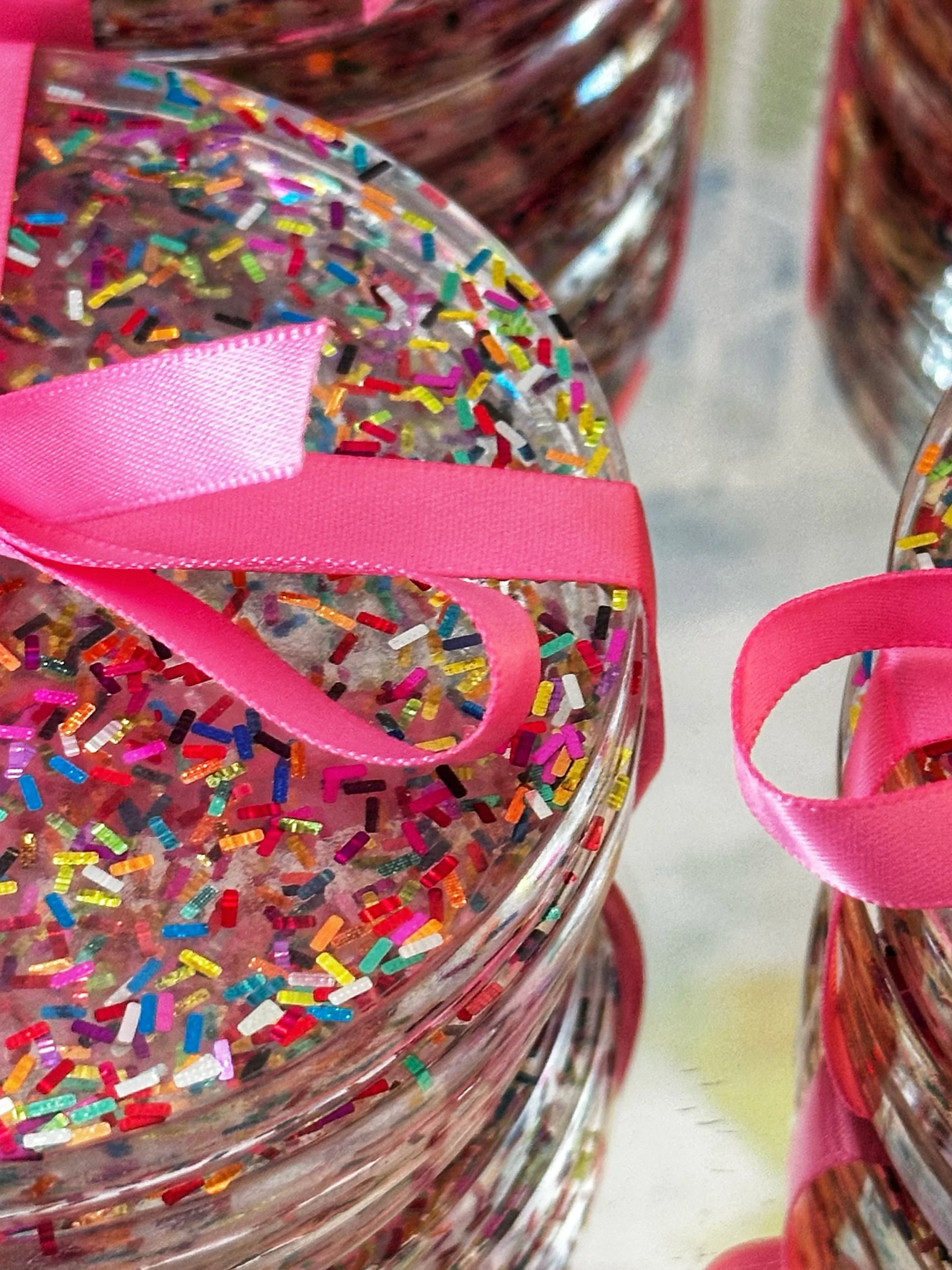 Crushing on these! 😍 A little party for your tabletop! 🎉✨ Our Sprinkle Confetti Coasters are handmade with colorful sparkle and finished with the prettiest pink ribbon&mdash;perfect for gifting, celebrating, or simply making happy hour more fun. 💕