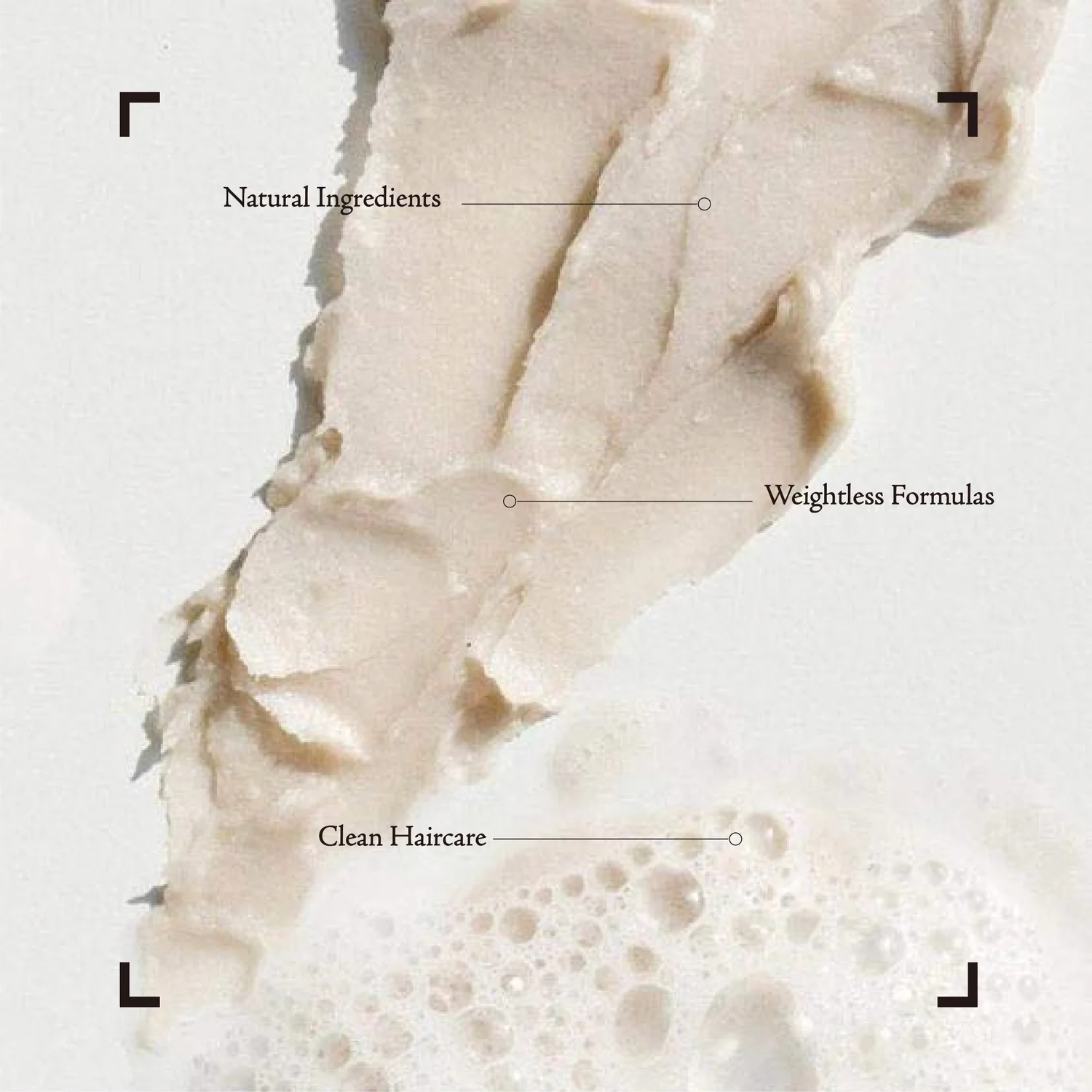A diagram of a hair care product with labels indicating natural ingredients, weightless formulas, and clean haircare.