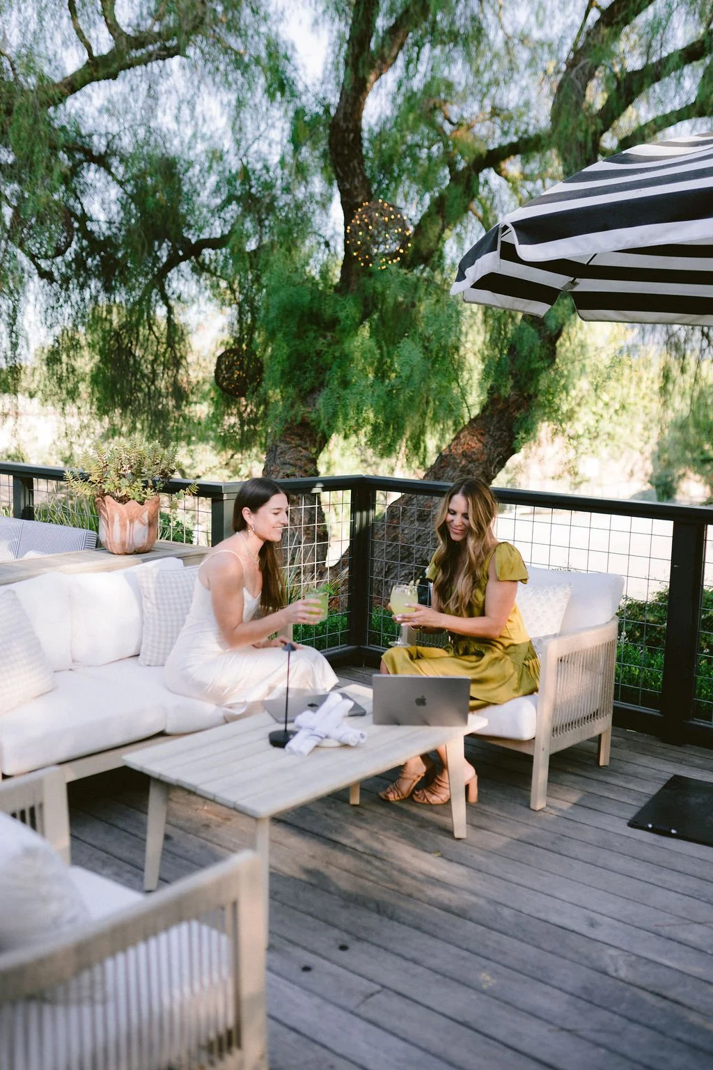 Vive Marketing Collective founders Allison and Lauren meeting outdoors for a team conversation