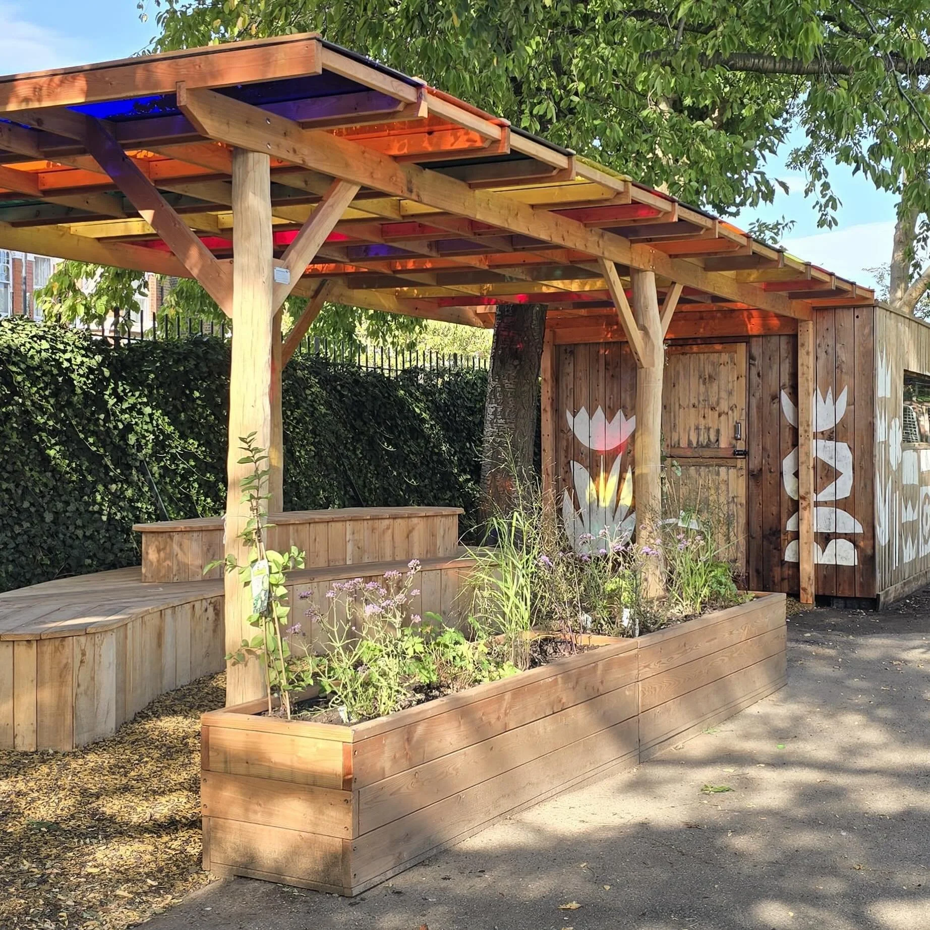 Shade, seating and plants - what every playground needs! At Green Play Project we do more than just play - we also have extensive experience designing and building bespoke shelters and seating to enhance play spaces, extend classroom activities and p