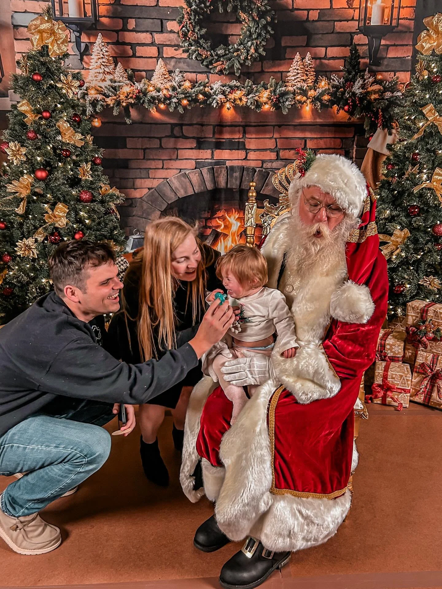 Emmy&rsquo;s first Christmas photo with Santa. She was not convinced at first, but one candy cane later and all was right in her world again. 🎅🏼🎄 @dragonsbaseball #DeckTheDiamond