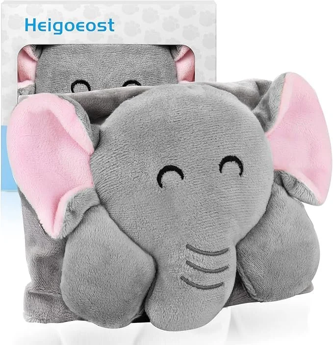Soft plush gray elephant backpack with pink inside ears, smiling face, and small trunk, placed on a white surface.