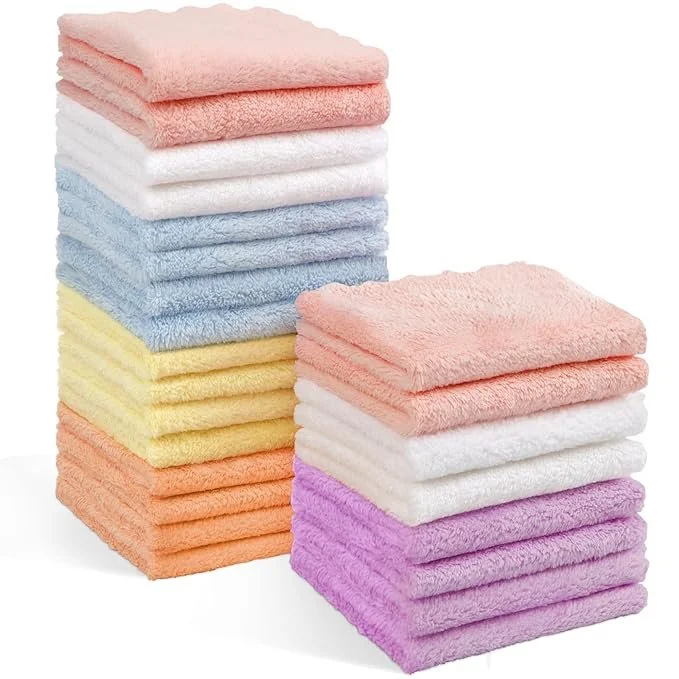 Stack of colorful folded towels in pink, white, purple, blue, and yellow.