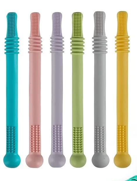 Six textured toothbrushes in blue, pink, purple, light green, gray, and yellow, arranged vertically.