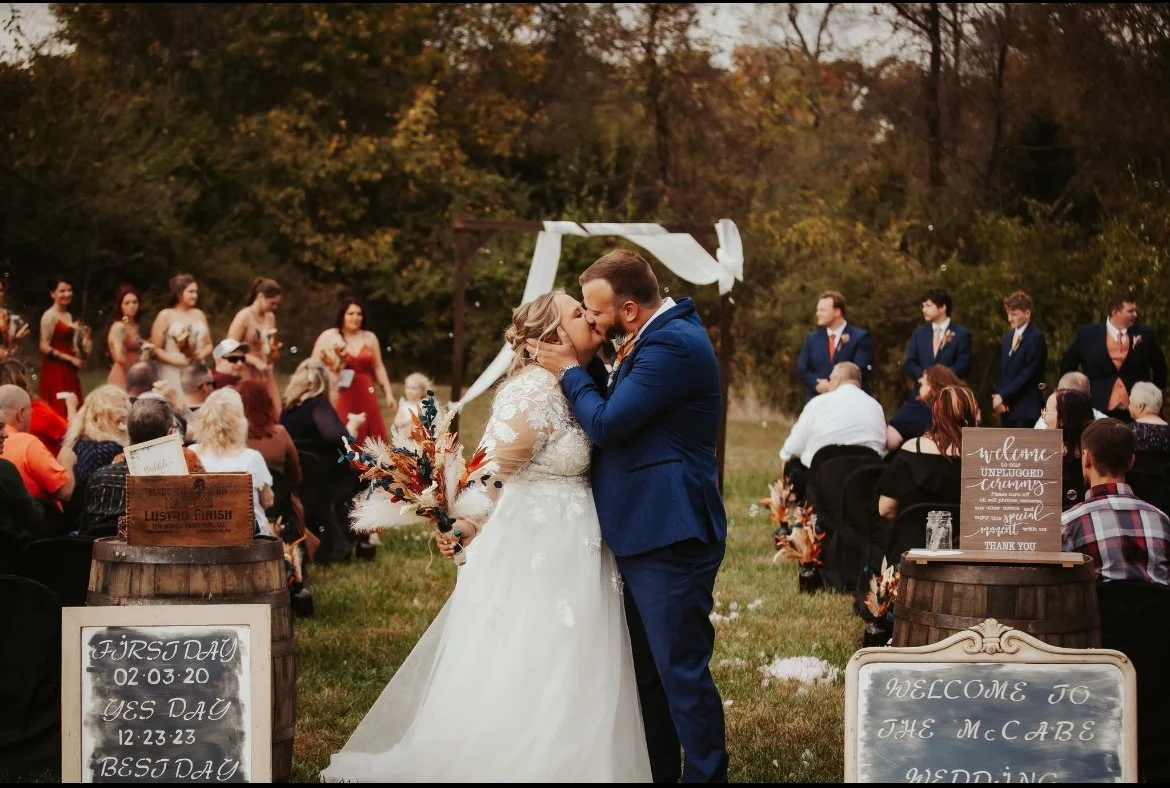 Outside wedding in October. Use of whiskey barrels as entrance for the Bride.  Congratulations Mr. and Mrs. McCabe! 