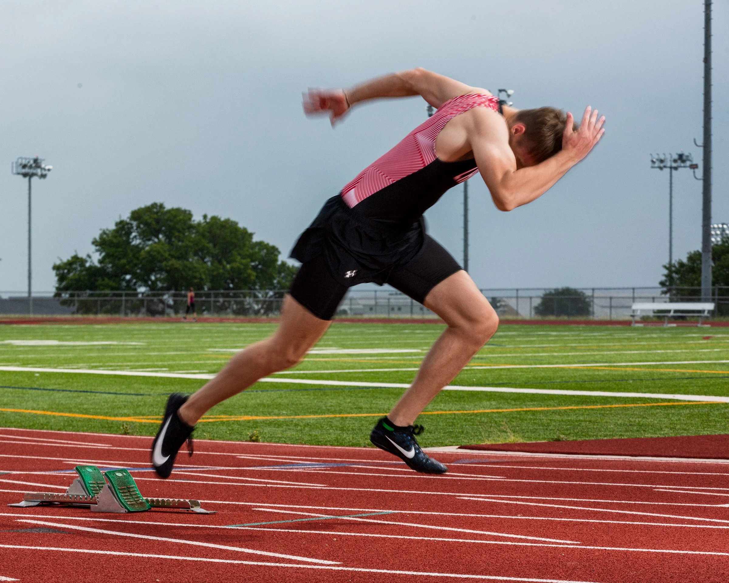Urban senior portrait with refined styling and balanced lighting.