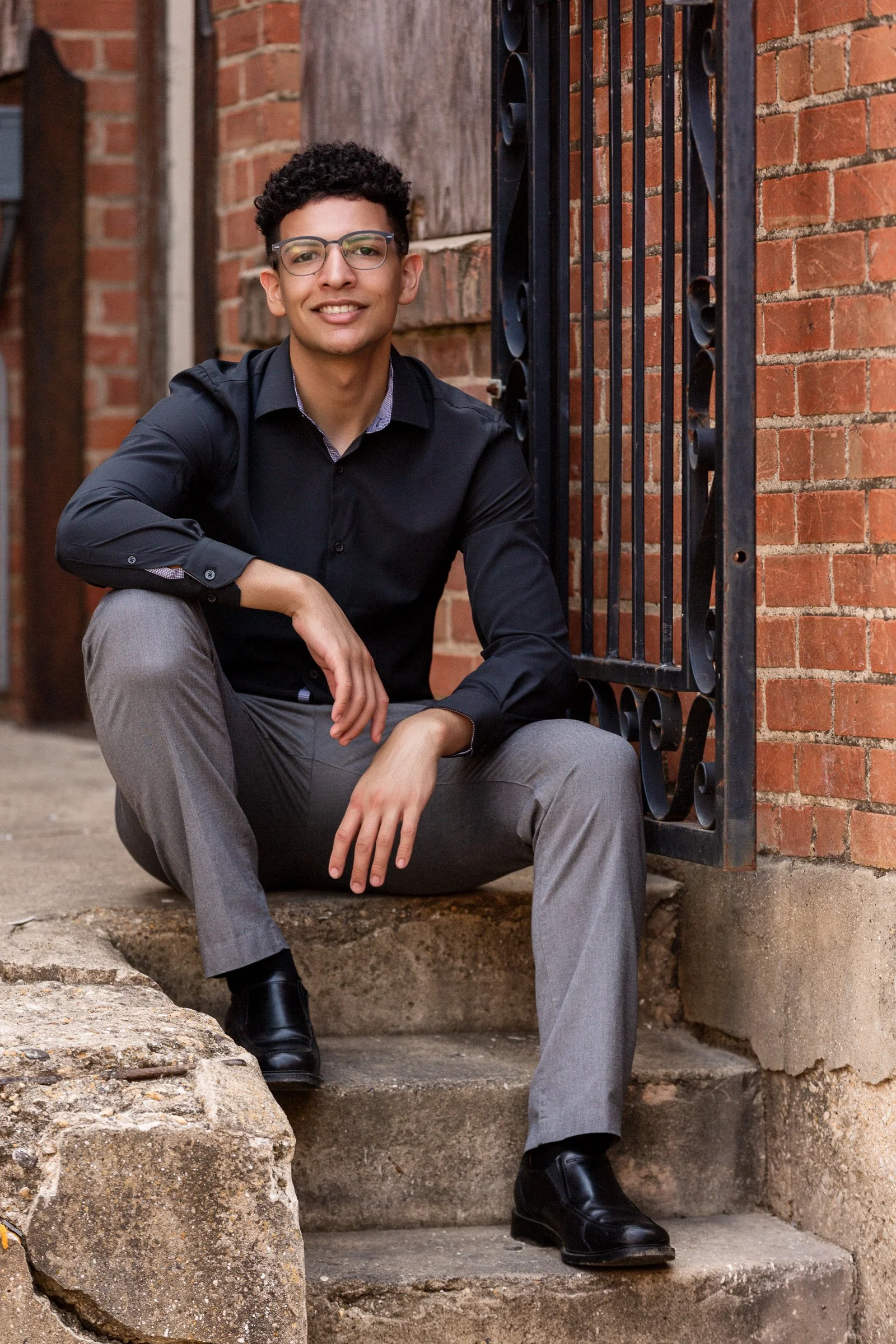 Senior portrait with strong pose and editorial-inspired styling.