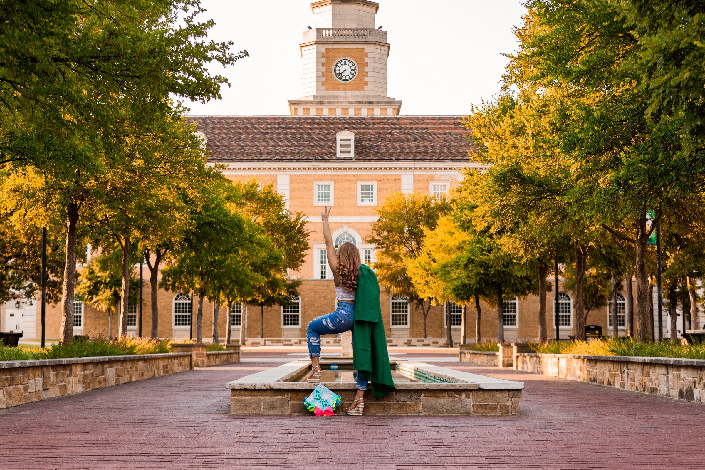Lifestyle senior portrait blending casual fashion with confident posture.