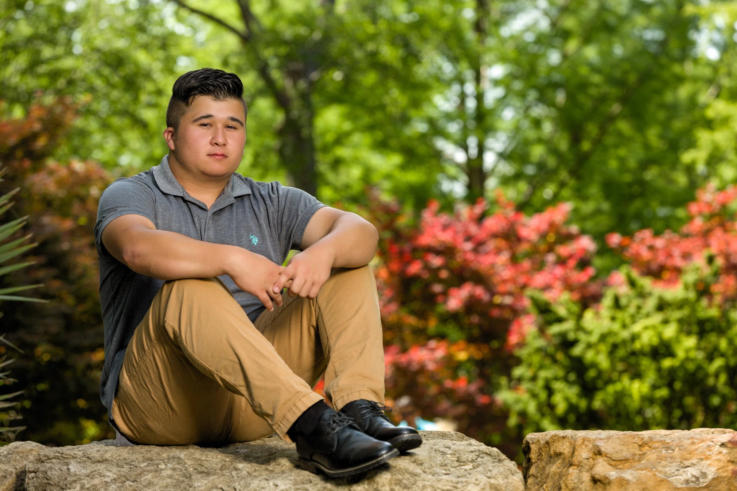 Senior graduation portrait celebrating academic achievement.