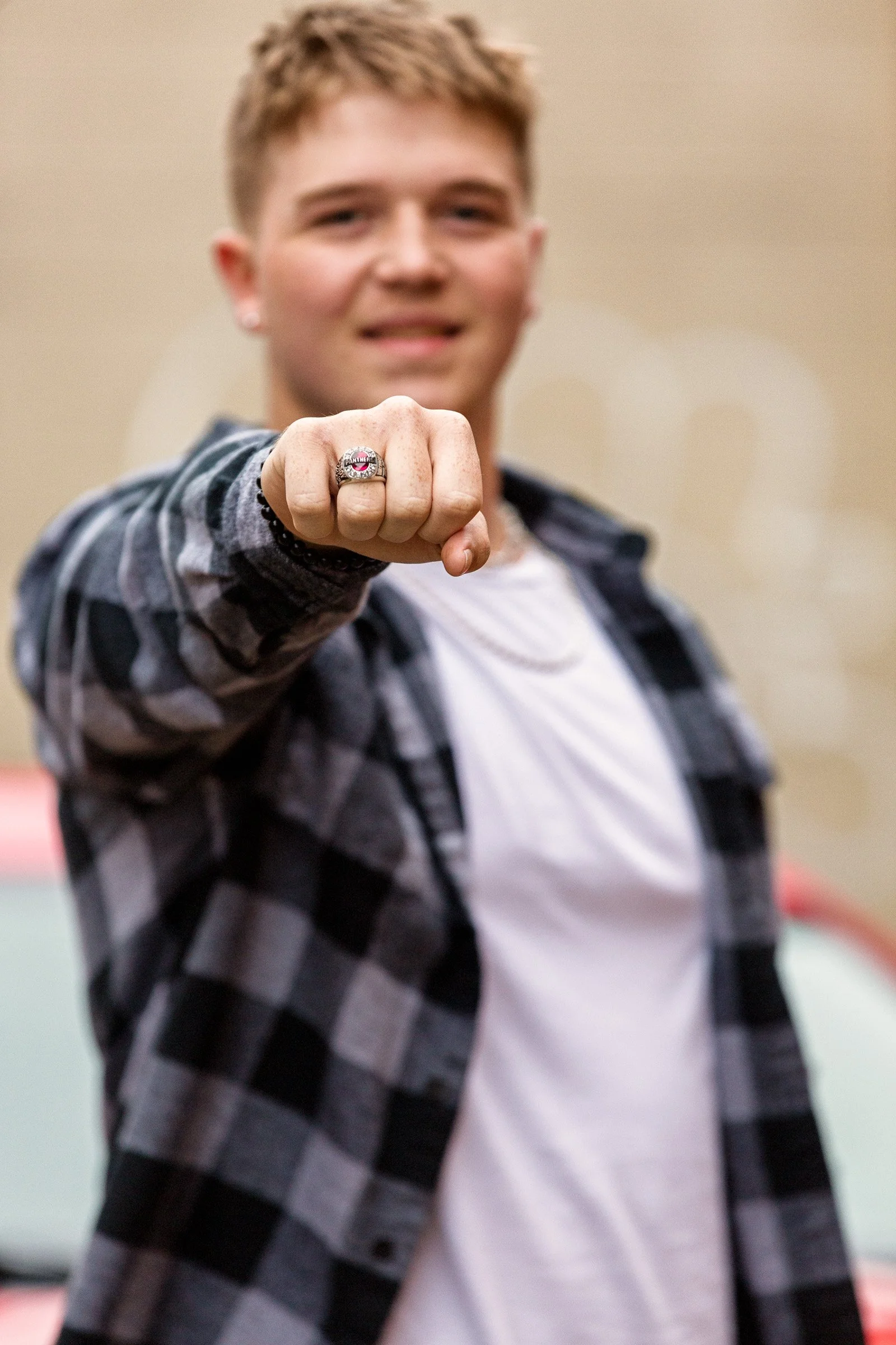 Urban senior portrait with refined styling and balanced lighting.