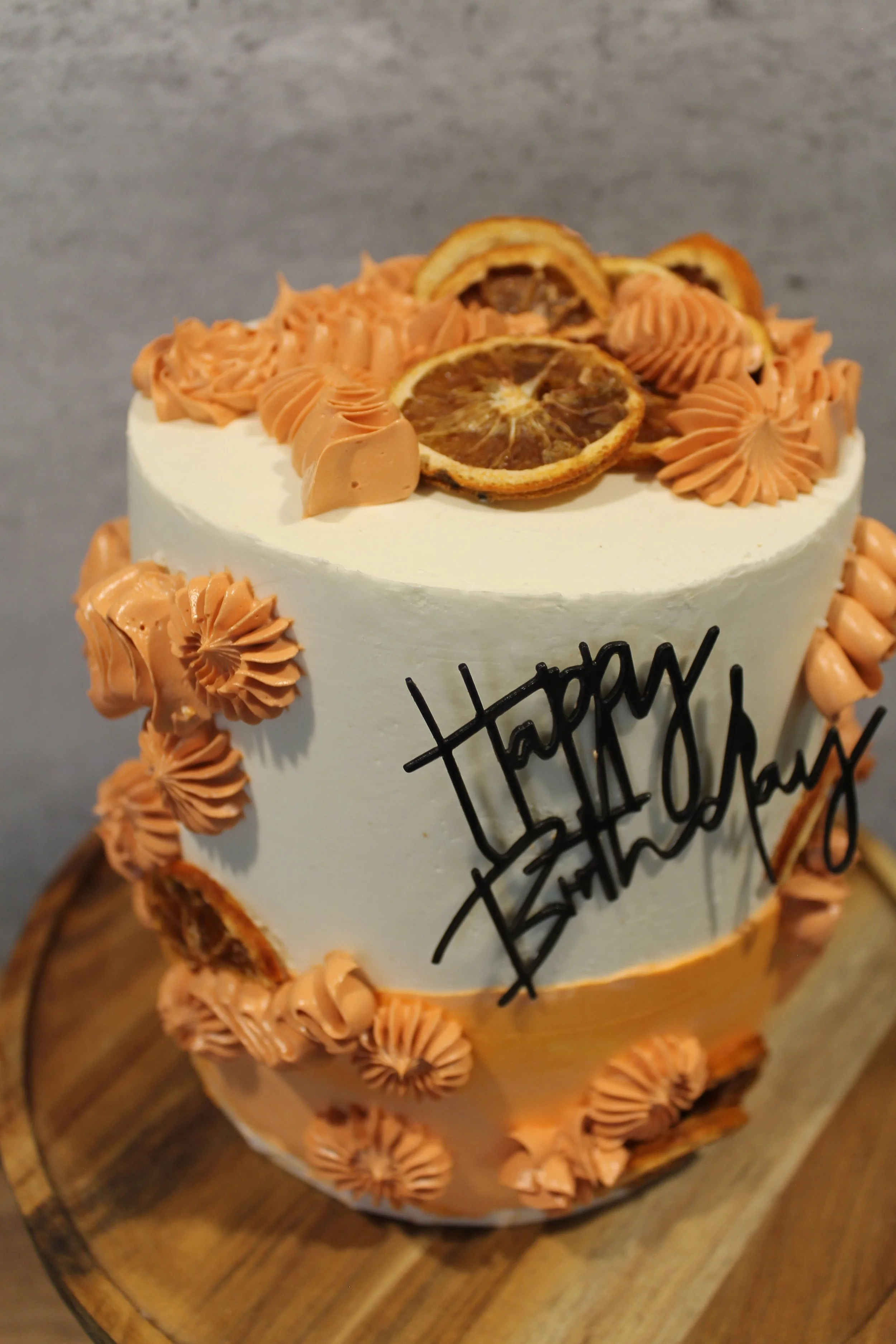 Orange cream happy birthday cake 