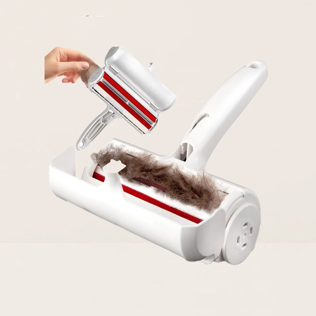 A Pet Hair Remover Roller picking up pet hair and debris from the floor.