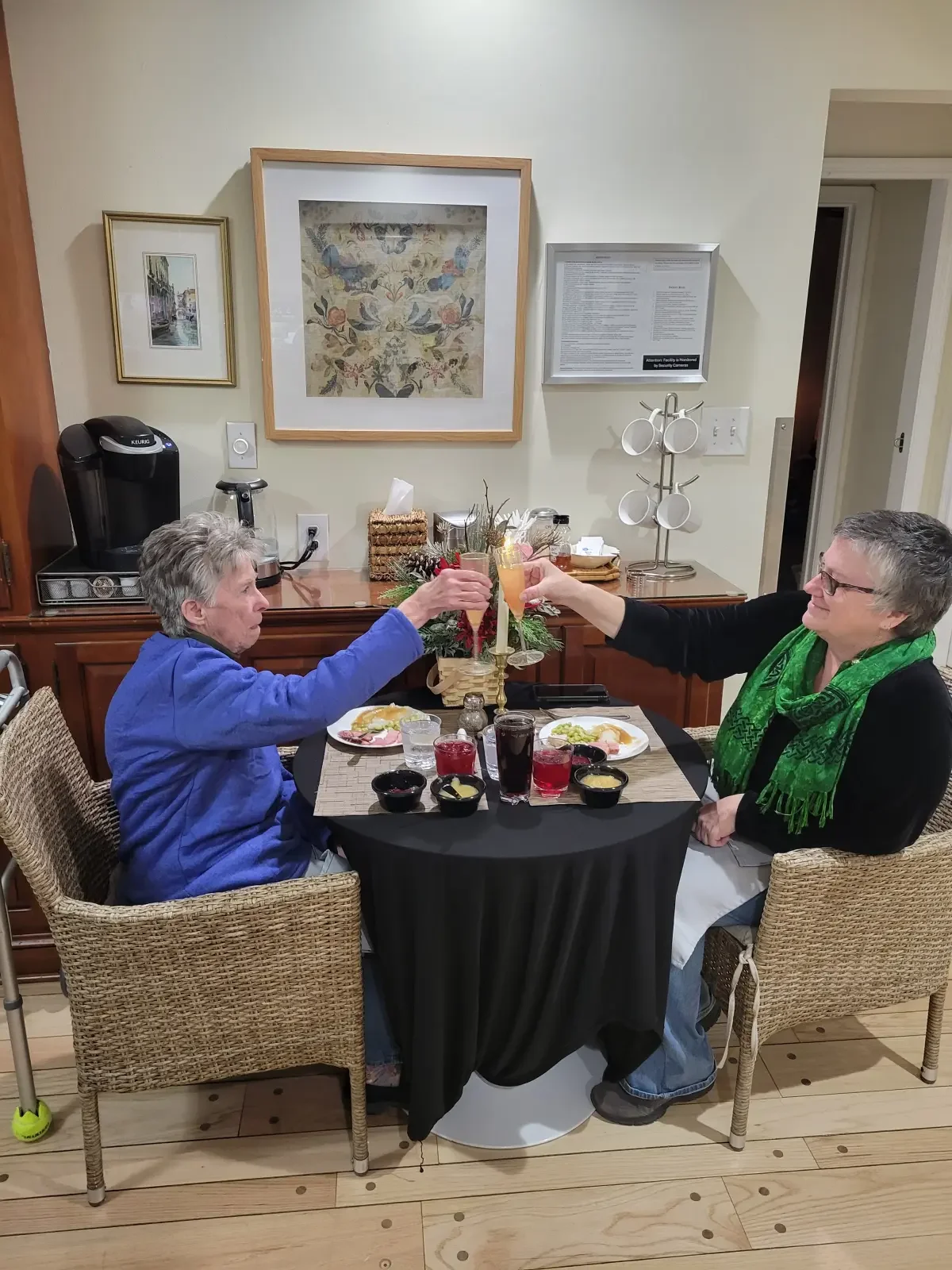 Resident and her daughter sharing a holiday meal at Broad Creek Manor Assisted Living in Harford County.